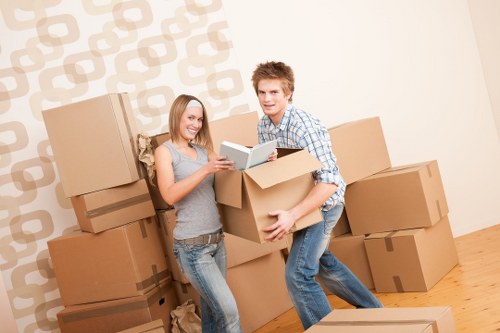 Professional movers from Adam Van Hire handling office equipment